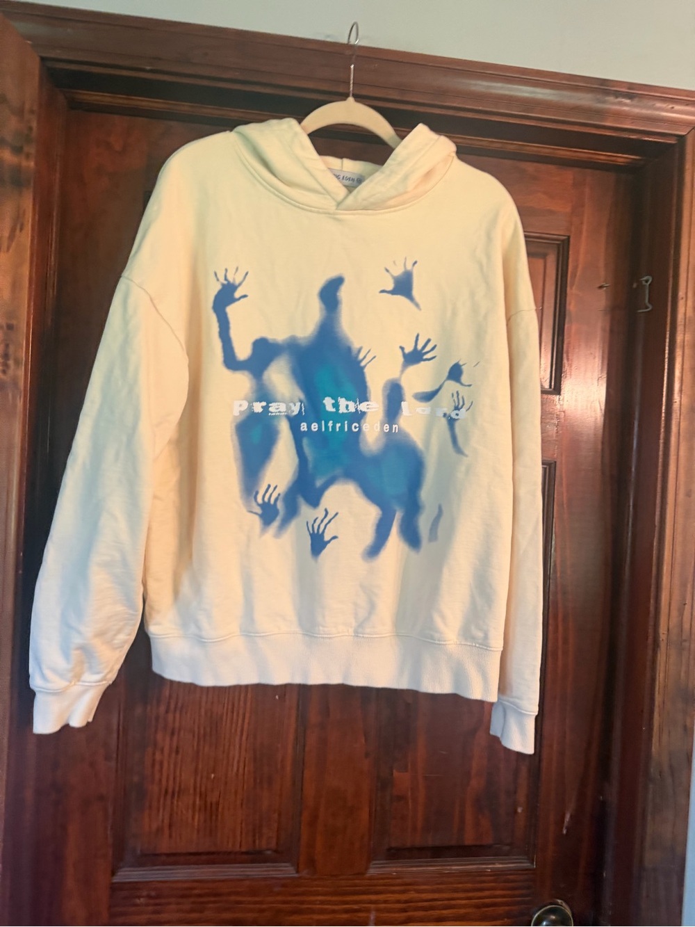 Aelfric Eden Cream Hoodie with Blue Graphic Hands
